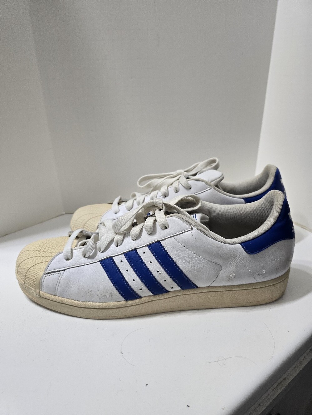 Adidas Superstar White Sneakers with Blue Stripes
